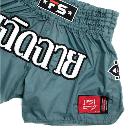Teal Mono Nylon Lotus Granite Muay Thai shorts with vintage-inspired embroidery and patches.