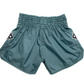Mono Nylon Lotus Granite Muay Thai training shorts in teal nylon with elastic waistband and embroidered patches.